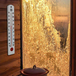 16" Vertical Outdoor Thermometer on wood-panelling next to an icy window
